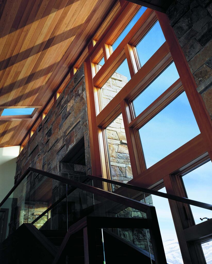 Modern Home Pathway Brightened by Andersen Windows Using the Andersen 400 Series Awning Window and 400 Series Casement Window