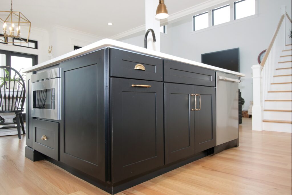 Charcoal gray kitchen island with custom kitchen cabinet
