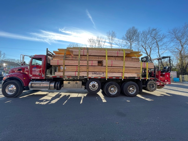 Builders’ General truck carrying building supply materials